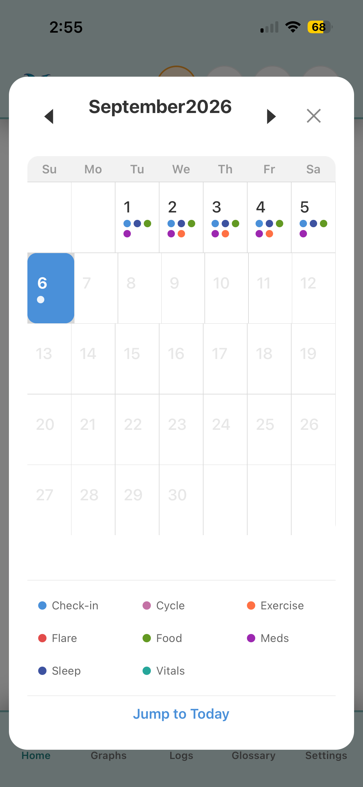 Month calendar view with color-coded dots for each logged category.